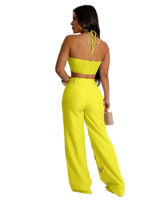 Woman wearing a bright yellow outfit against a white background