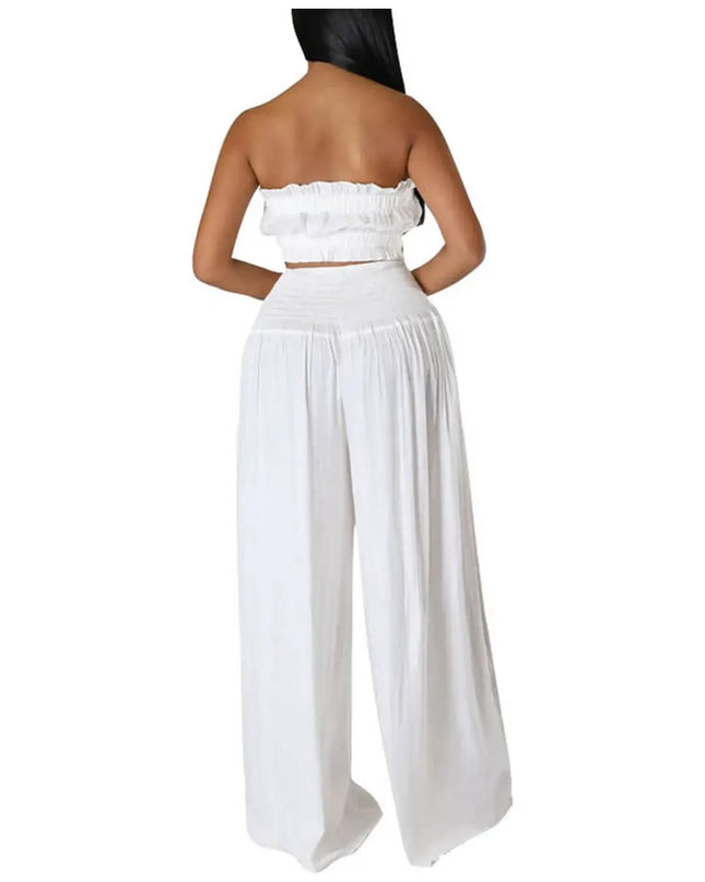 Back view of a stylish women's solid white strapless two-piece pantsuit, showcasing relaxed wide-leg pants.