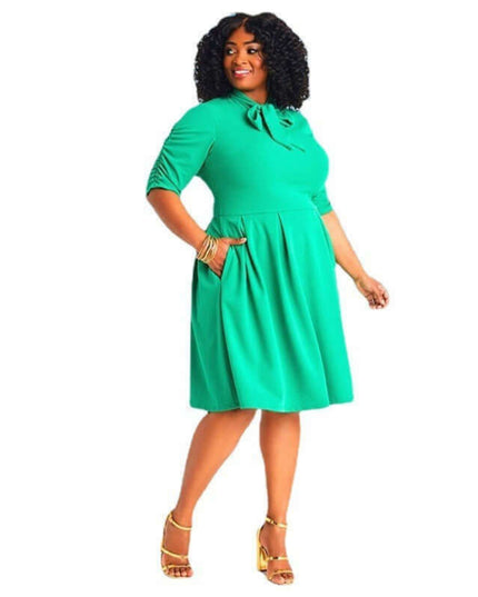Woman wearing a green dress on a white background