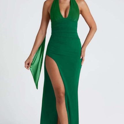 Elegant green halter dress with a deep V-neck and side slit, perfect for casual or formal occasions.