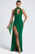 Elegant green halter dress with a deep V-neck and side slit, perfect for casual or formal occasions.