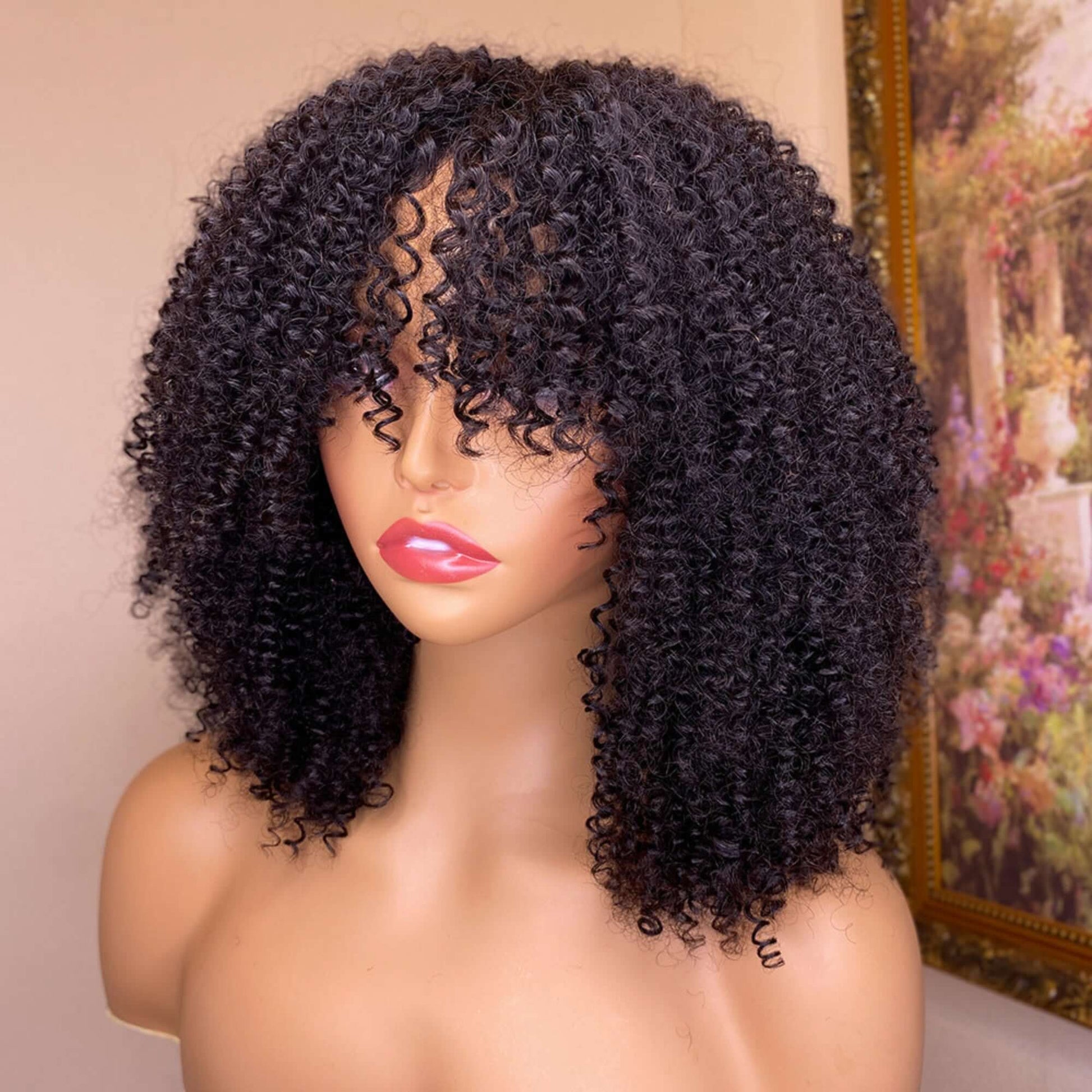 Mannequin head with a black curly wig against a neutral background