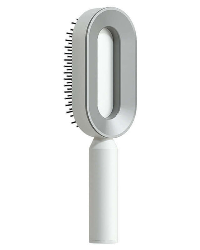 White grooming brush with bristle head on a white background