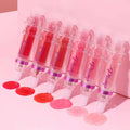 Lip Mirror Liquid Lipstick collection featuring 6 shades with glossy finishes on a pink background.