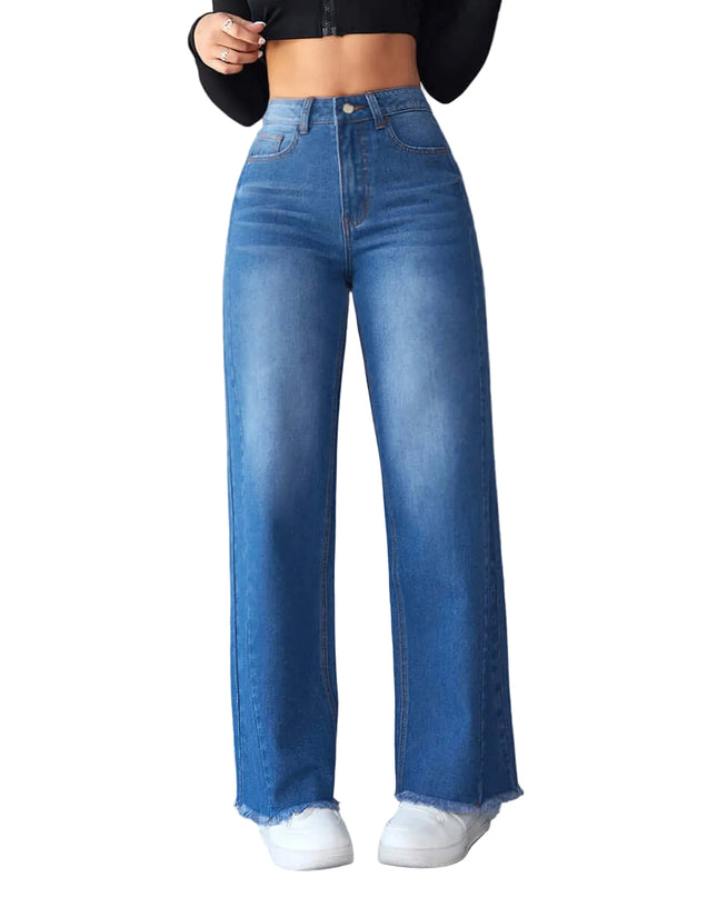 Person wearing blue jeans against a gray concrete wall