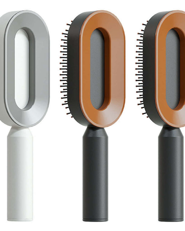Three pet grooming brushes with different handle colors on a white background
