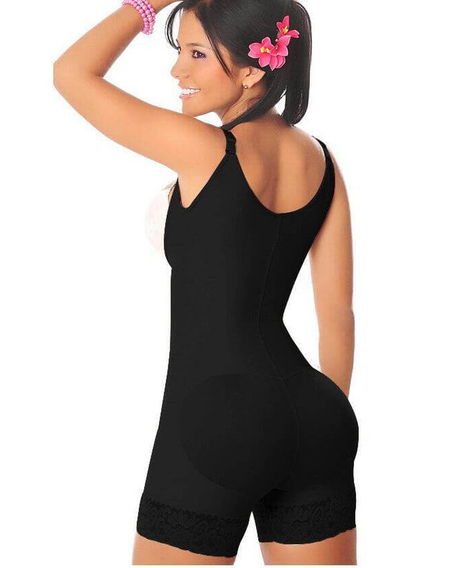 Woman modeling a black full body shaper bodysuit with a floral hair accessory, showcasing a smooth silhouette.