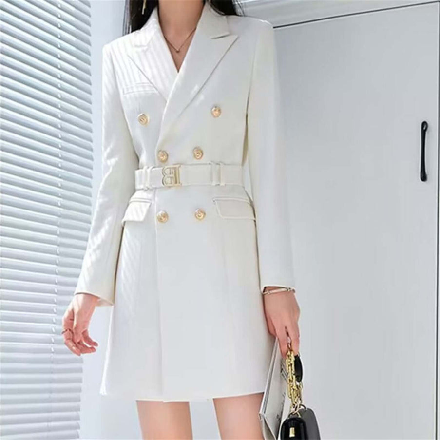 White double-breasted coat with gold buttons and a belt, worn by a person.