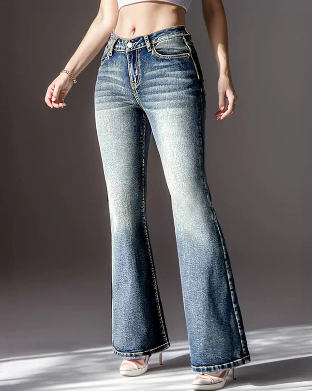 Person wearing blue flared jeans on a gray background
