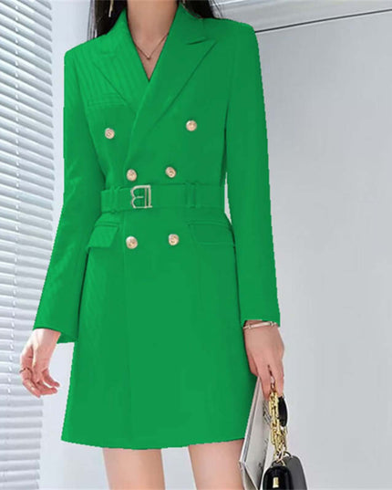 Green double-breasted coat worn by a person with a neutral background