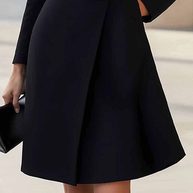 Elegant midi dress with belt showcasing a stylish black skirt and a sophisticated look for modern women.
