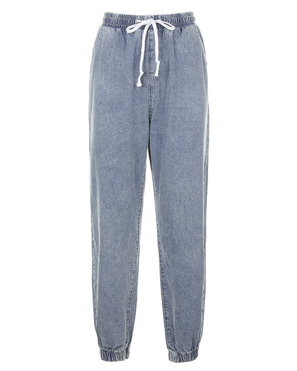 Women's strappy denim jeans featuring an elastic waistband and jogger style for comfort and style.