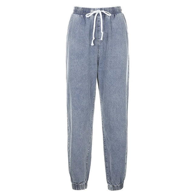 Women's strappy denim jeans featuring an elastic waistband and jogger style for comfort and style.