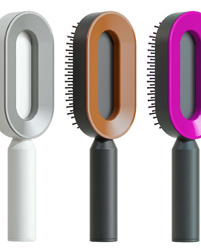 Three pet grooming brushes with different colored handles on a white background