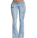 Light blue jeans with decorative belt and stitching on a neutral background