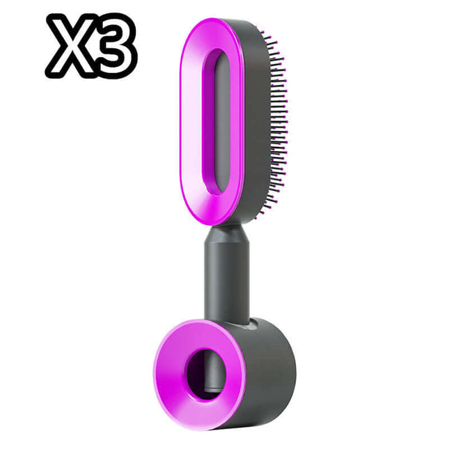 Pet grooming brush with pink and black design on a white background