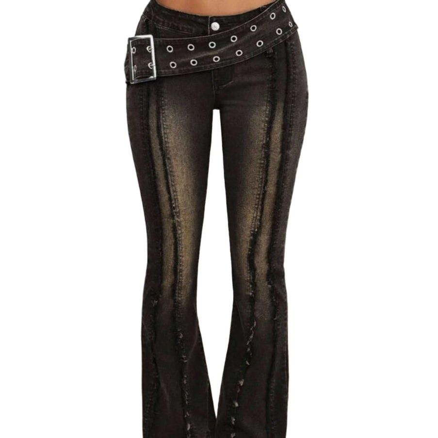 Black flared jeans with a studded belt on a neutral background