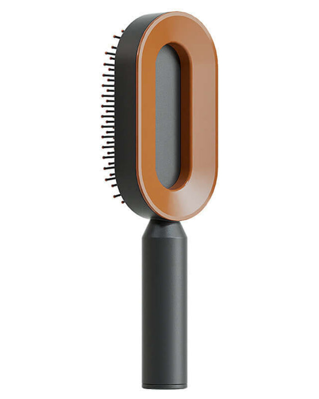 Pet grooming brush with brown and black design on a white background