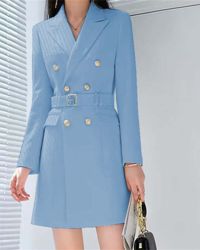Light blue coat with gold buttons worn by a person, standing against a neutral background.