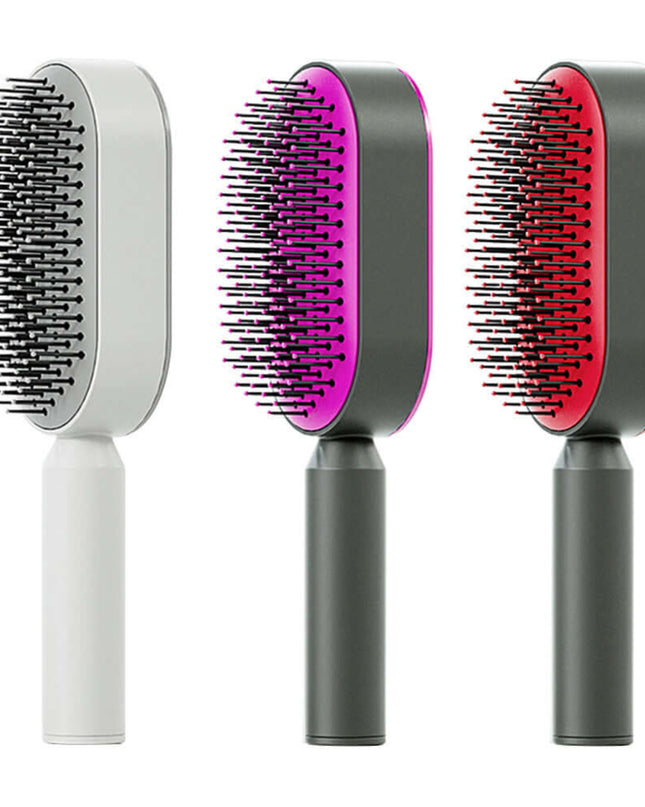 Three pet grooming brushes with different color designs on a white background