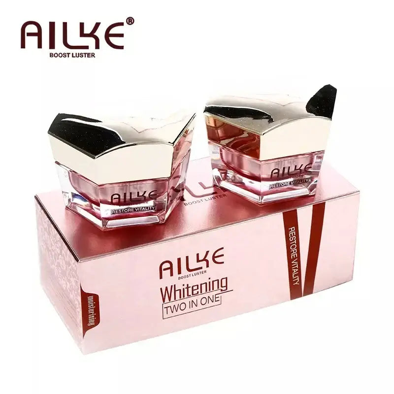 AILKE whitening two-in-one face cream jars in a pink box, designed to boost skin luster and hydration.