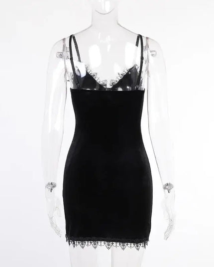 Vintage black cross mini dress showcasing its sexy spaghetti straps and sleek design.