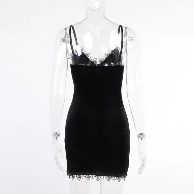 Vintage black cross mini dress showcasing its sexy spaghetti straps and sleek design.