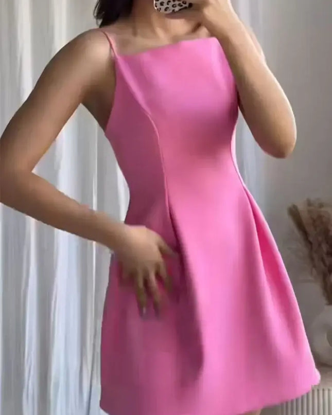 Pink A-Line Mini Dress featuring adjustable spaghetti straps and flattering A-line silhouette.