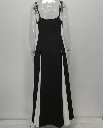 Back view of a stylish black and white color contrast evening party dress, showcasing its chic, sleeveless, swing maxi design.
