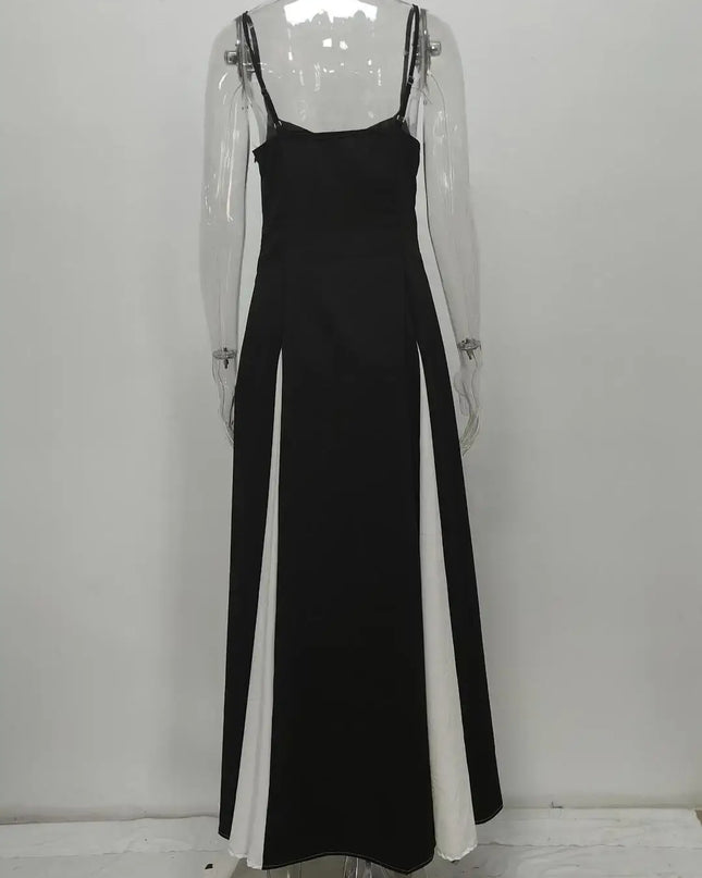 Back view of a stylish black and white color contrast evening party dress, showcasing its chic, sleeveless, swing maxi design.