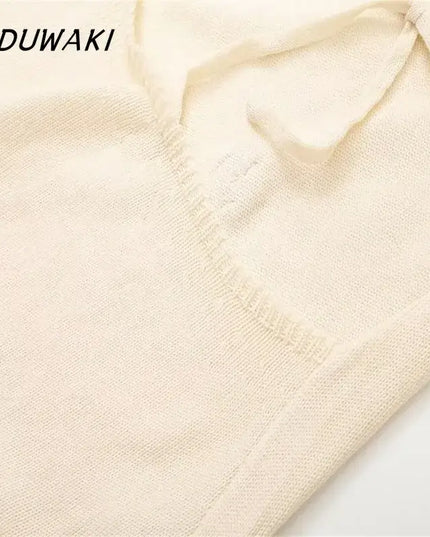 KADUWAKI gothic embroidered dresses for women detail of the knitted fabric in cream color.