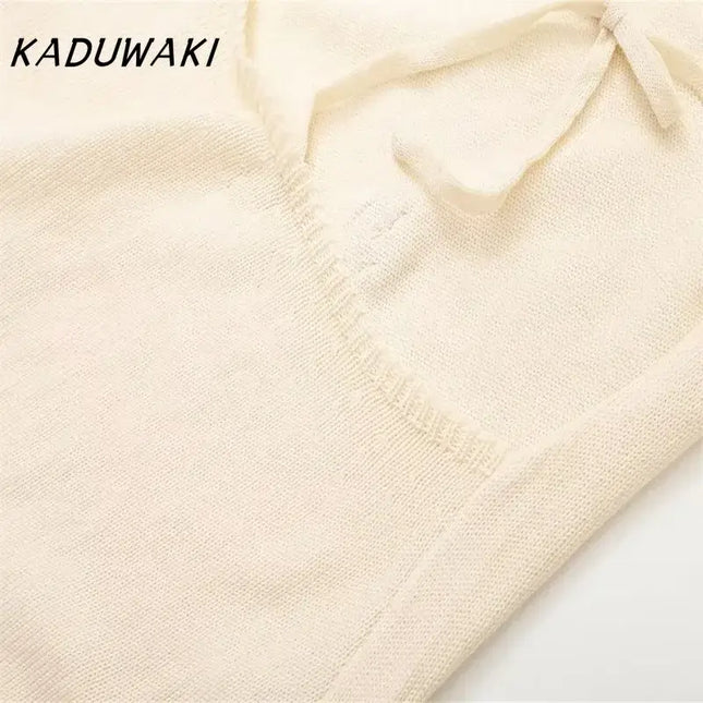 KADUWAKI gothic embroidered dresses for women detail of the knitted fabric in cream color.