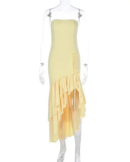 Sexy strapless summer dress in yellow with irregular hemline, showcasing a fashionable and edgy style.