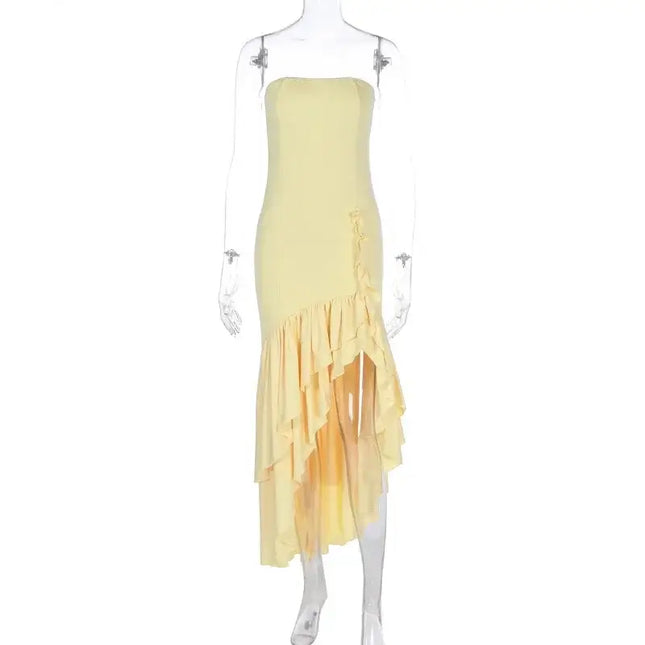 Sexy strapless summer dress in yellow with irregular hemline, showcasing a fashionable and edgy style.