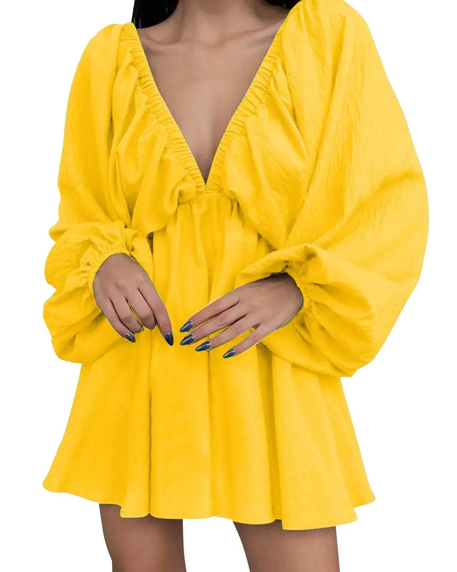 Yellow dress with long sleeves on a white background