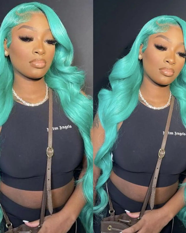 Person with teal hair styled in waves, wearing a black top and brown bag.