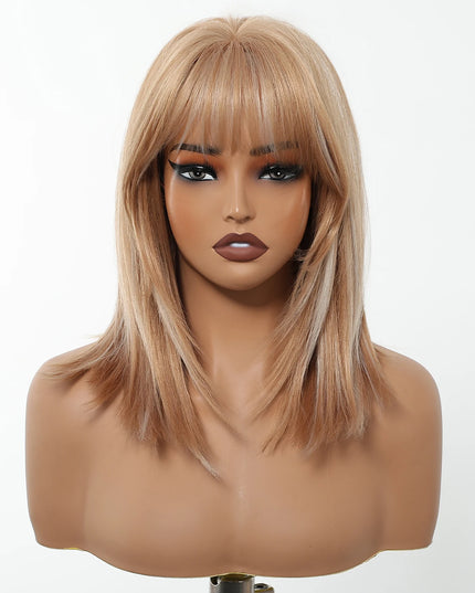 Blonde wig with bangs on a mannequin head against a white background