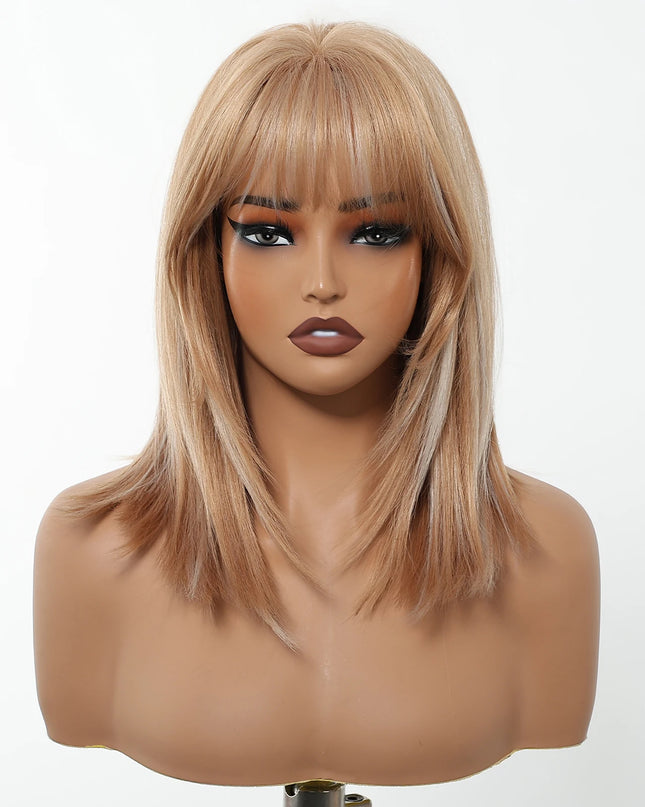 Blonde wig with bangs on a mannequin head against a white background