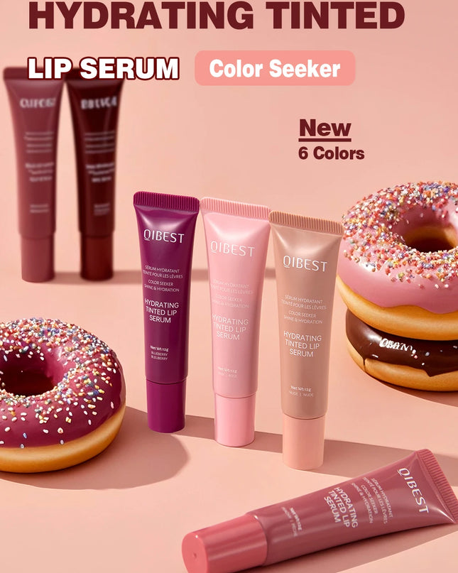 Quest lip serum tubes with donuts on a pink background