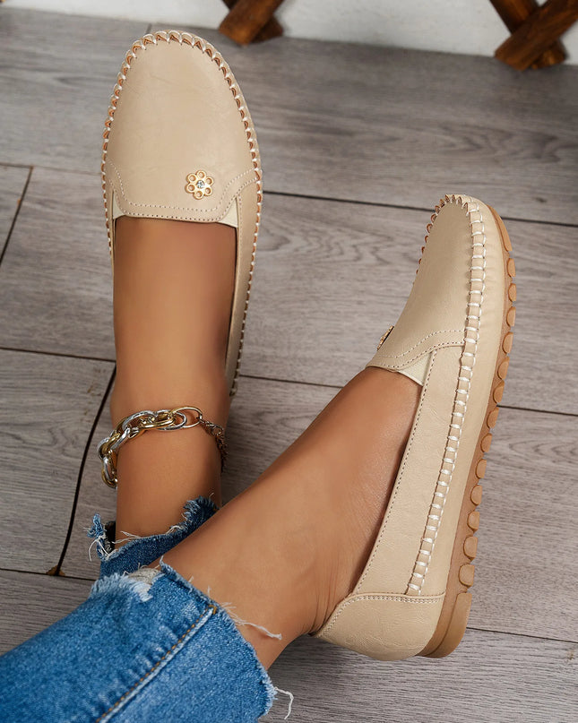 Comfortable Women's Loafers with laser stitch detail, beige flat slip-on shoes for casual streetwear style.