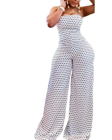 Woman wearing a polka dot jumpsuit on a white background