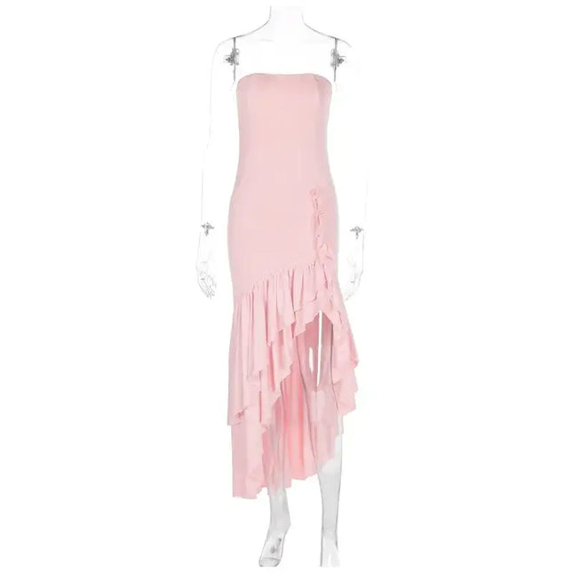 Sexy strapless summer dress in pink with ruffled asymmetrical hemline, perfect for spring and summer occasions.