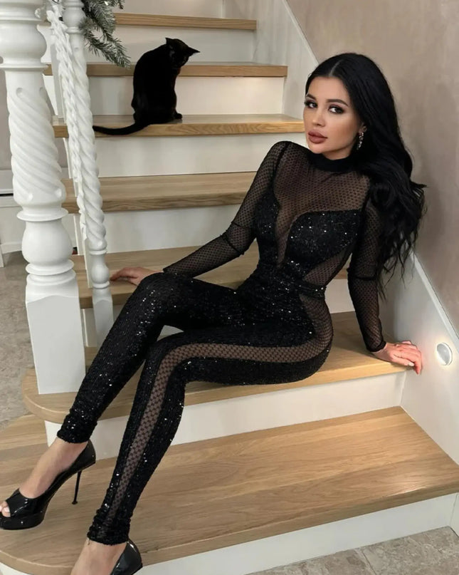 Woman in a black, sparkly outfit sitting on a staircase.