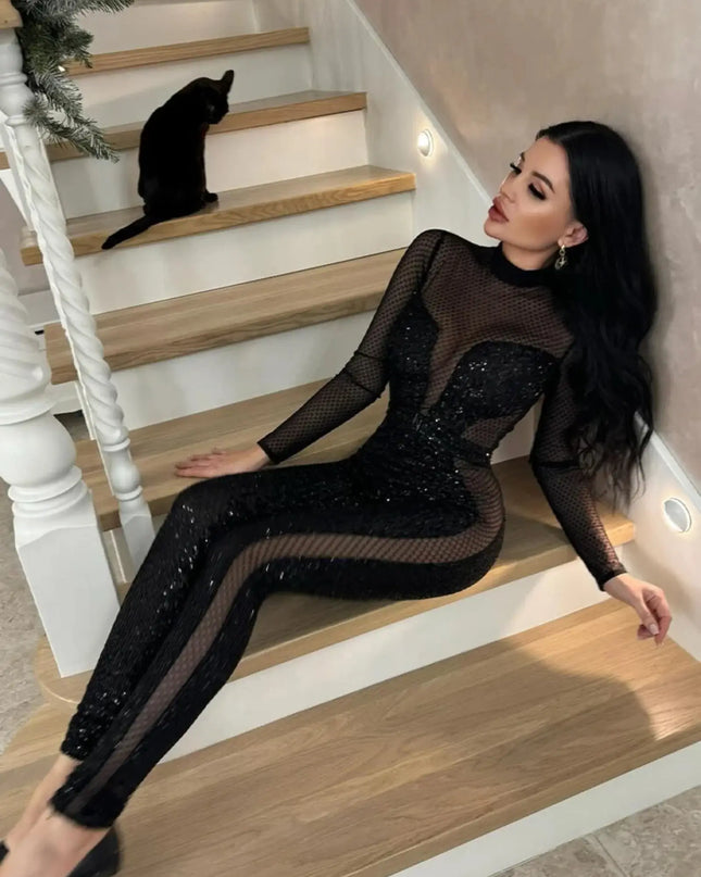 Woman in a black outfit sitting on a staircase with a cat on the steps.