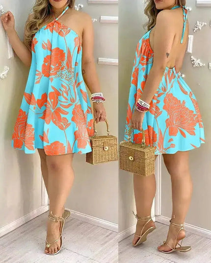 Tropical print halter neck dress in vibrant blue and orange, perfect for spring and summer vacations.