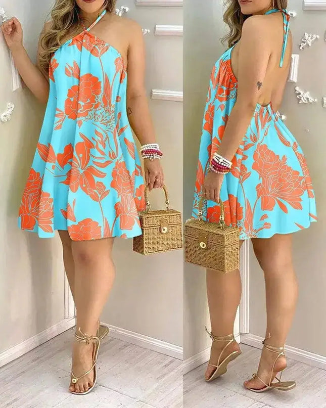 Tropical print halter neck dress in vibrant blue and orange, perfect for spring and summer vacations.