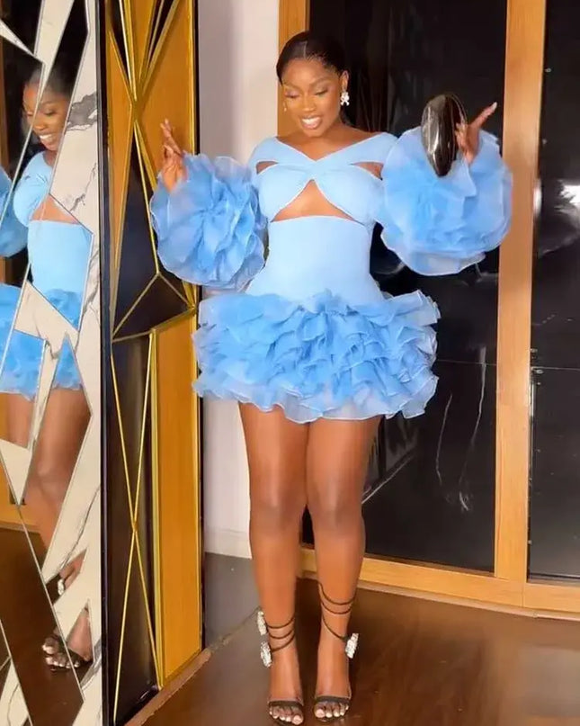 Model showcasing a petal sleeve mini dress with unique design, perfect for spring parties and celebrations.