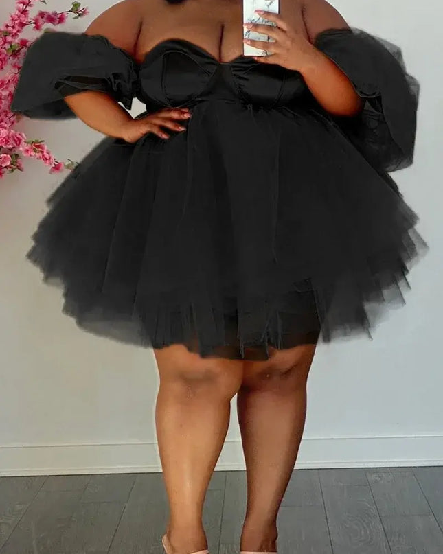 Plus size sexy v-neck mini dress featuring a black tulle design, perfect for parties and special occasions.