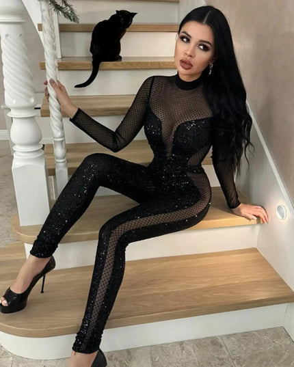 Woman in a black sequin outfit sitting on a staircase with a cat.