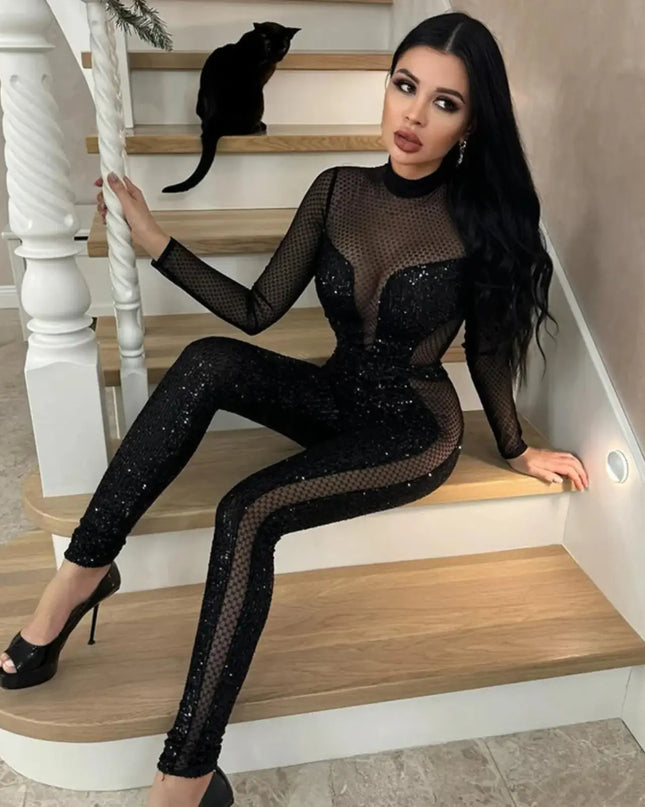 Woman in a black sequin outfit sitting on a staircase with a cat.